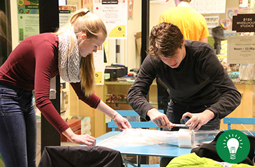 Programming Subcommittee - two people look over papers at a table