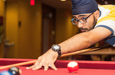 Man playing billiards at Sunburst Fest