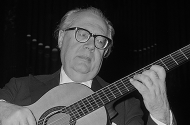 Andrés Segovia playing the guitar