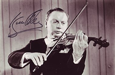 Signed photo of Isaac Stern playing violin