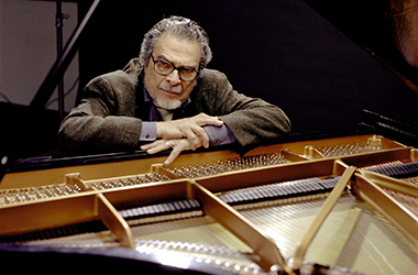 Leon Fleisher behind a piano