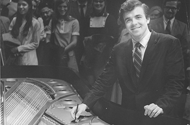 Misha Dichter signing a grand piano