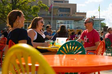 Wisconsin Union members sit at a table on the Terrace