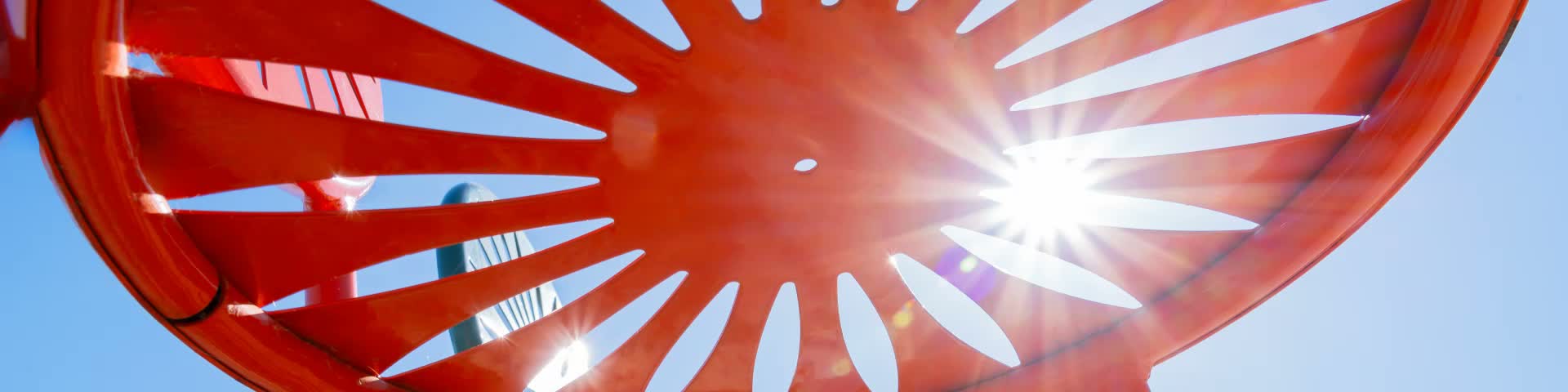Close-up shot of Terrace chair with sun shining through the cutouts.
