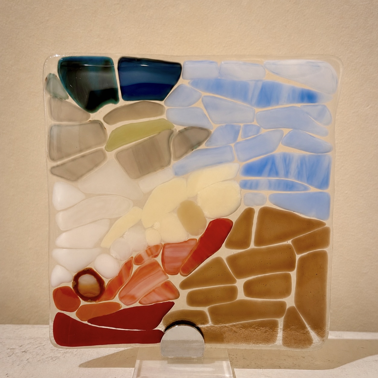 Picture of fused glass into a square.
