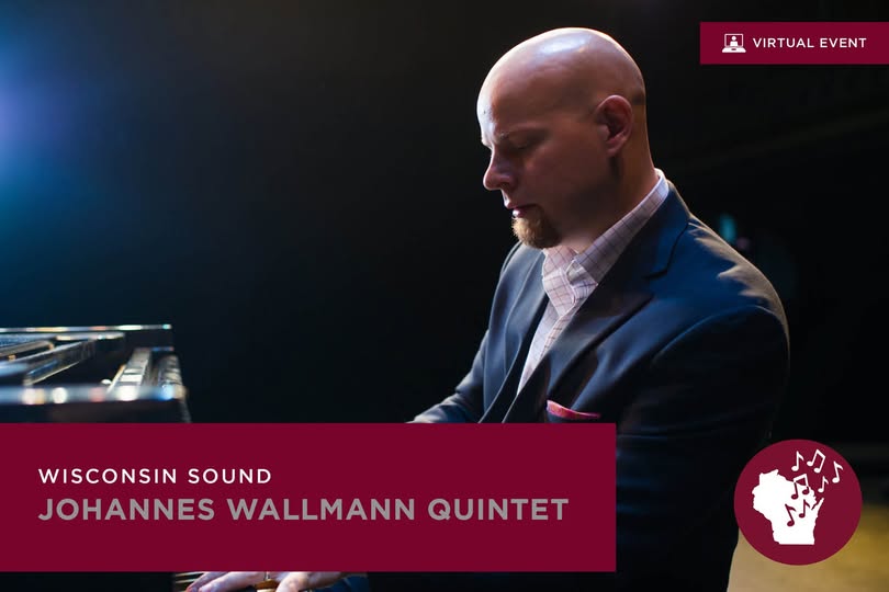 Johannes Wallmann playing the piano on a stage.