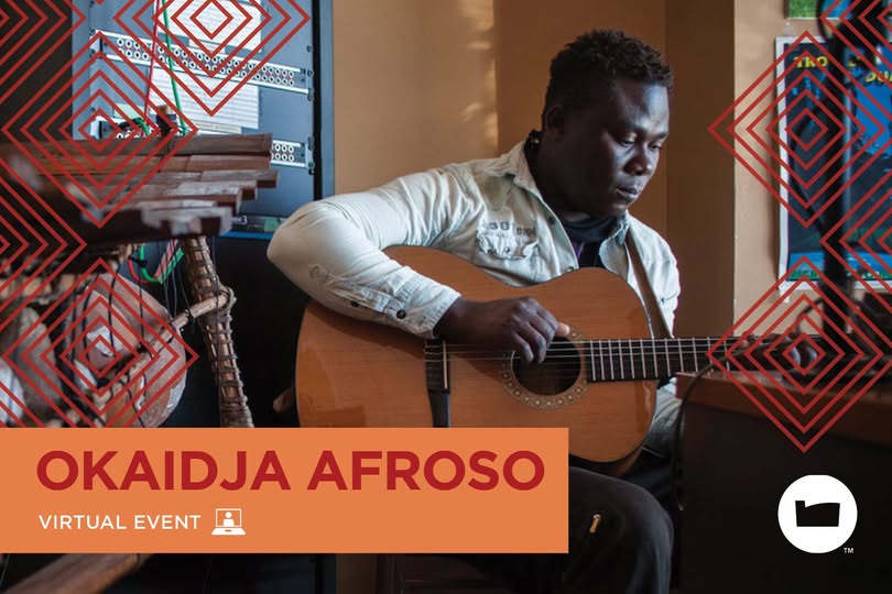 Okaidja Afroso playing the guitar.