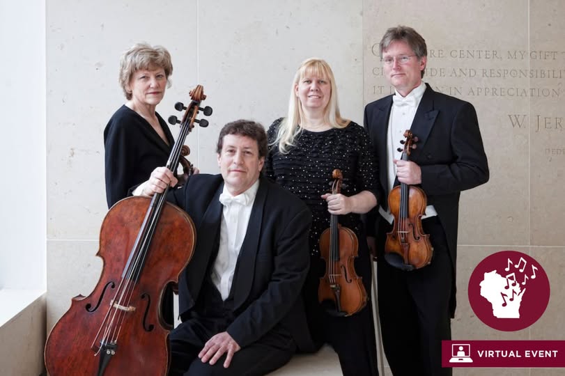 String quartet in formal attire holding their instruments.
