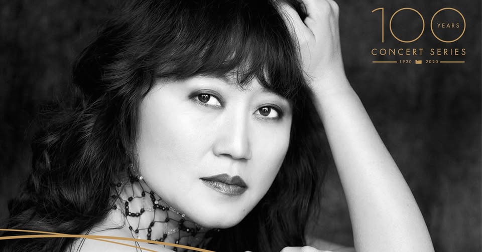 Close-up headshot of Wu Han in black and white.