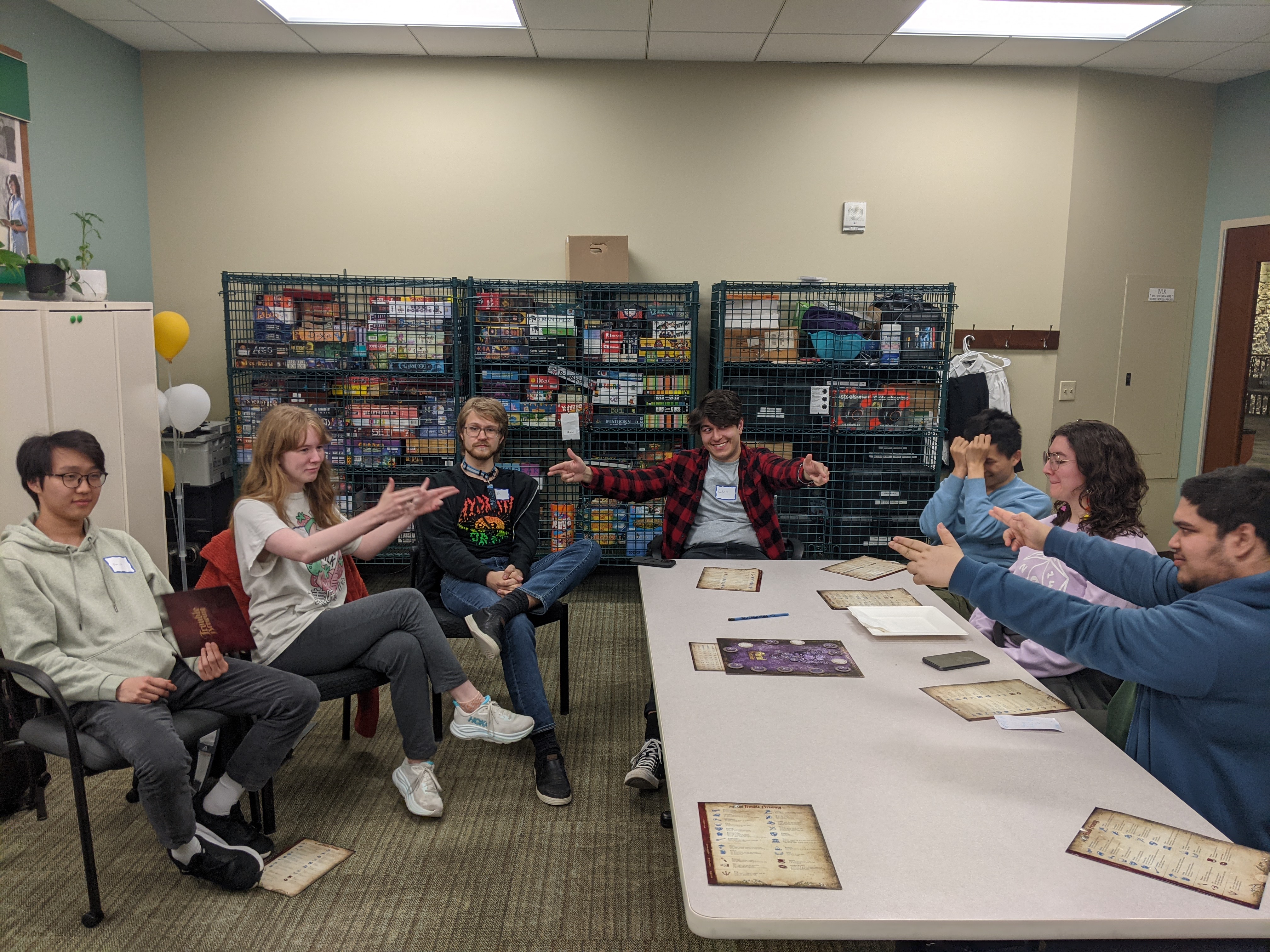 A group of students in a meeting discussing about future activities the club should do.