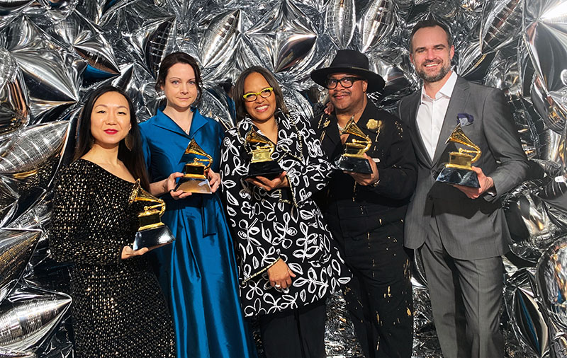 Linda May Han Oh, left, and Terri Lyne Carrington, center, pose with their 2023 Grammy Awards