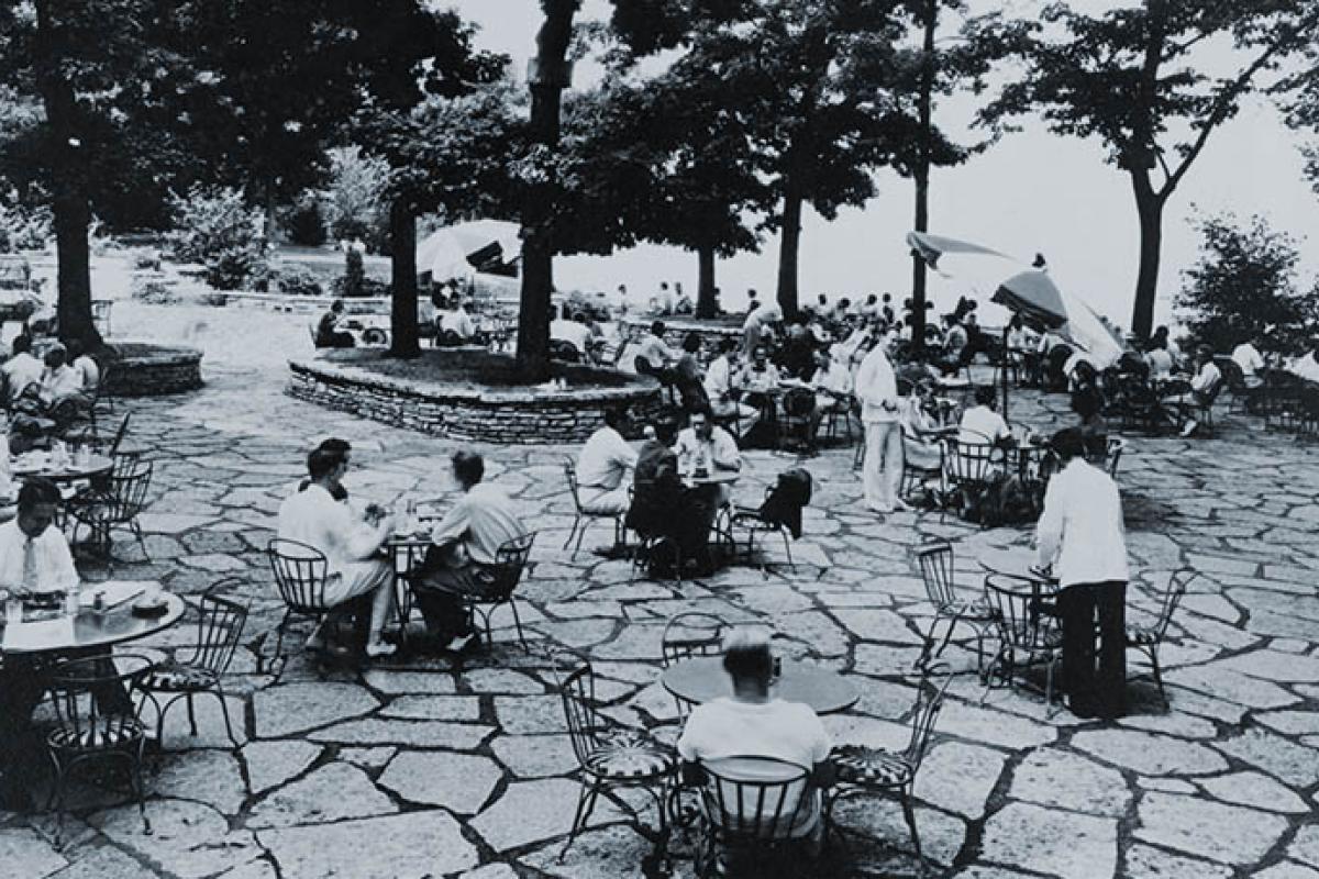 Terrace History: Black and white photo of patrons sitting at the tables on the terrace