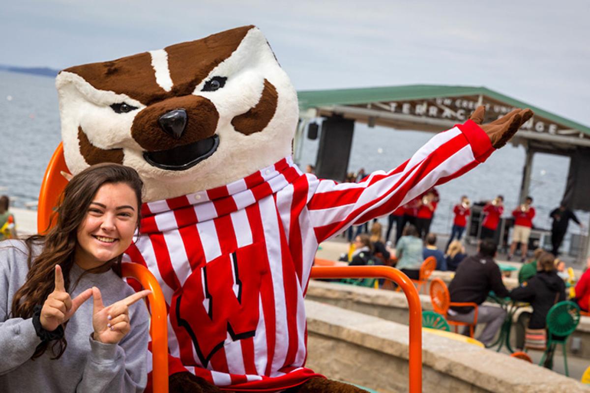 Student hanging out with Bucky on the Terrace