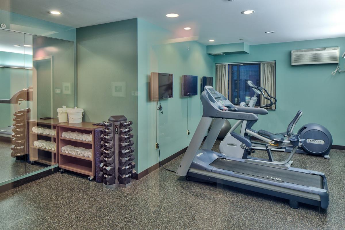 Union South Hotel gym equipment: treadmills and dumbbells