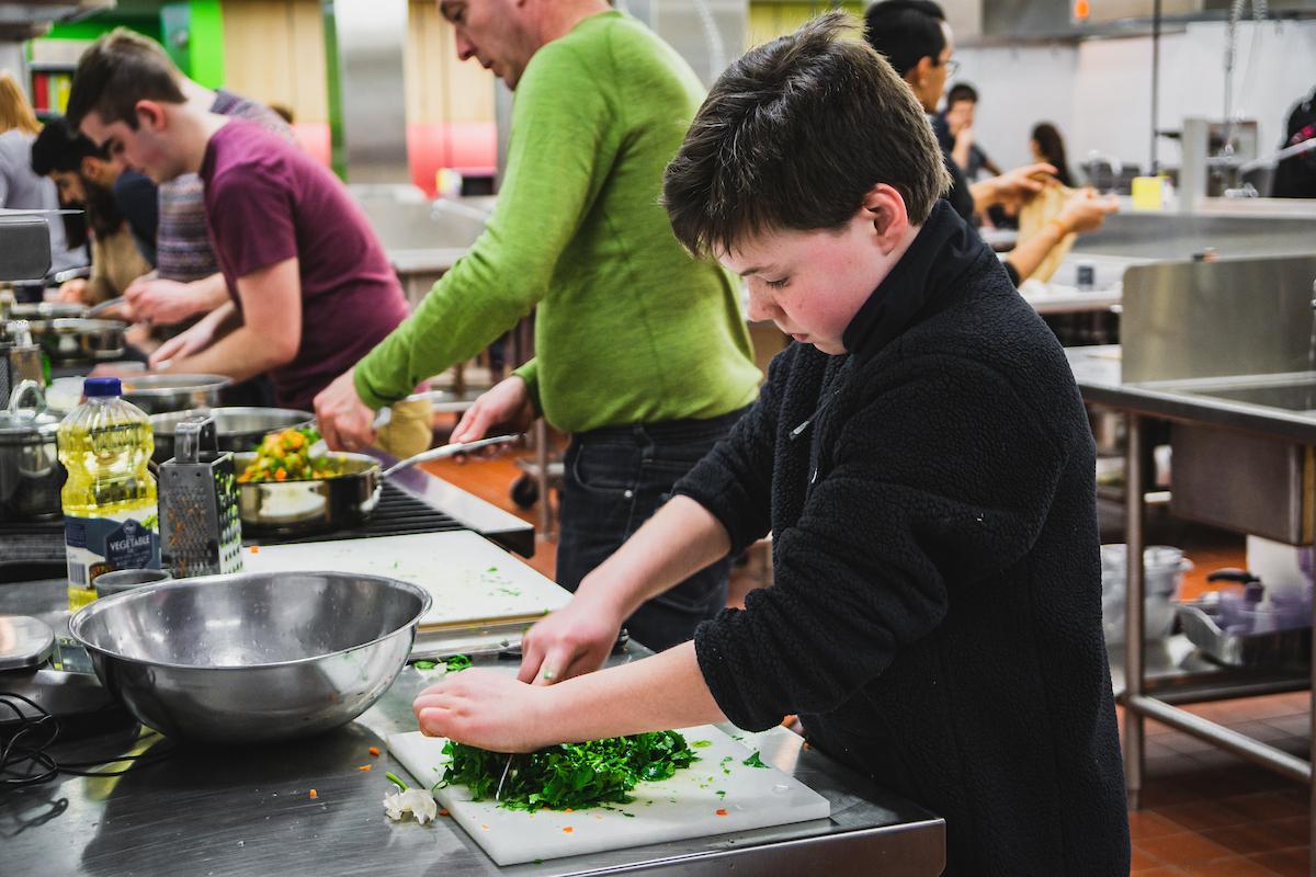 People chopping vegetables at a Babcock Hall cooking workshop