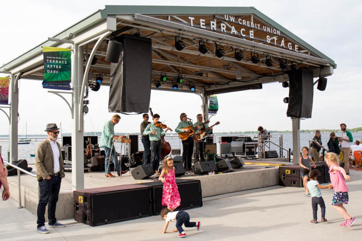 Children dancing in front of a live music performance at Terrace Stage