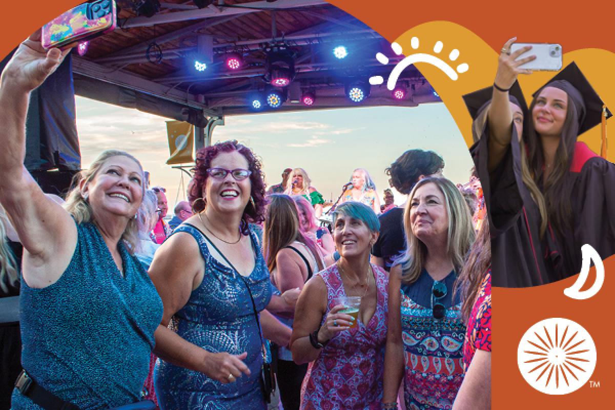 New graduates and group of alumni taking selfies