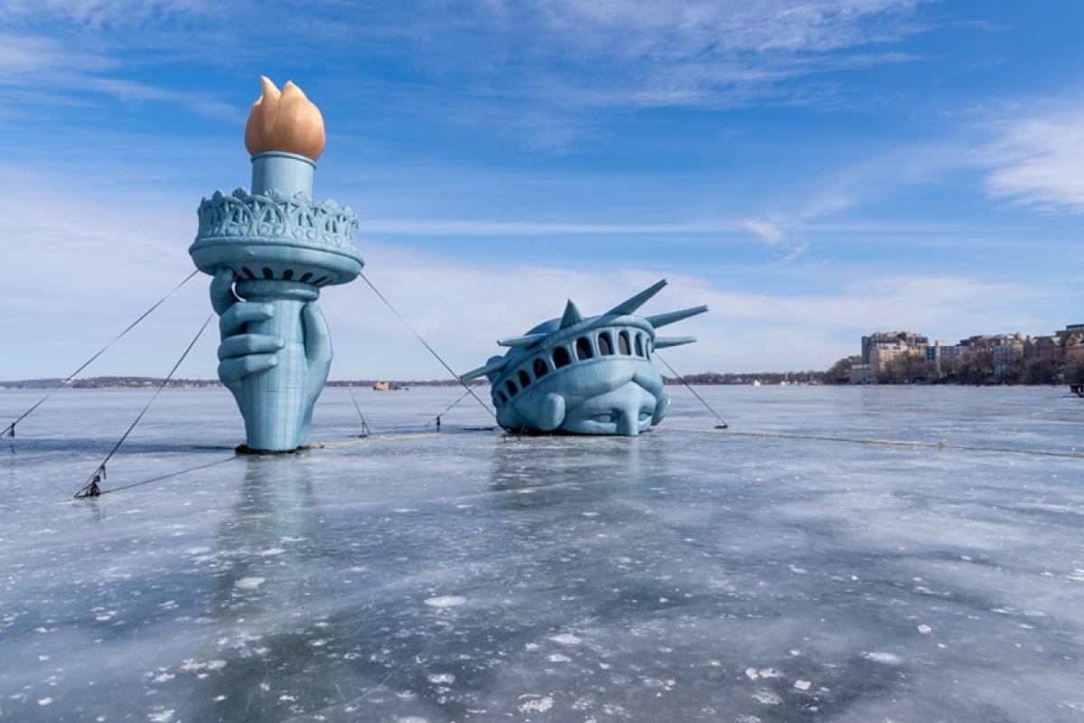 statue of liberty on lake mendota on sunny day