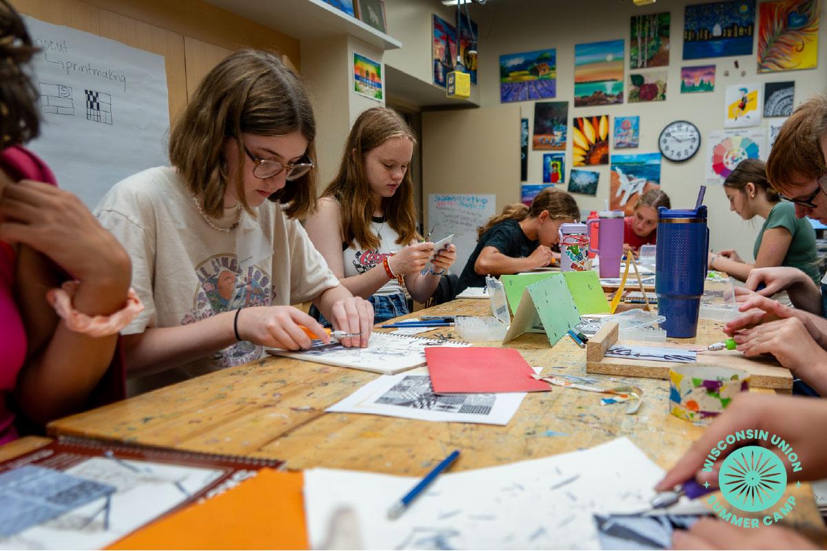 Group of children working on lino printing techniques.