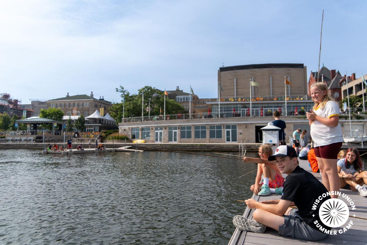 Group of children fishing off a dock at Memorial Union.