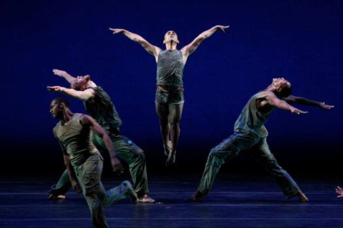 dancers perofrm in grey outfits