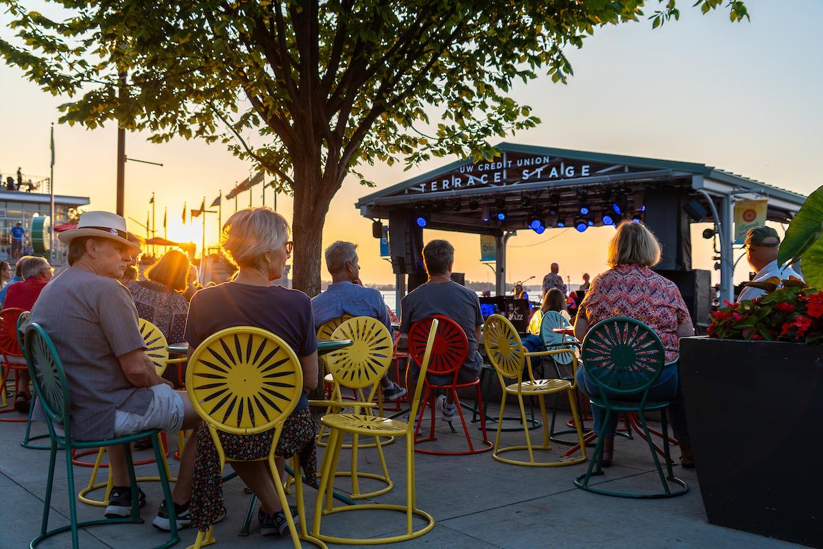 people sitting at the terrace at sunset