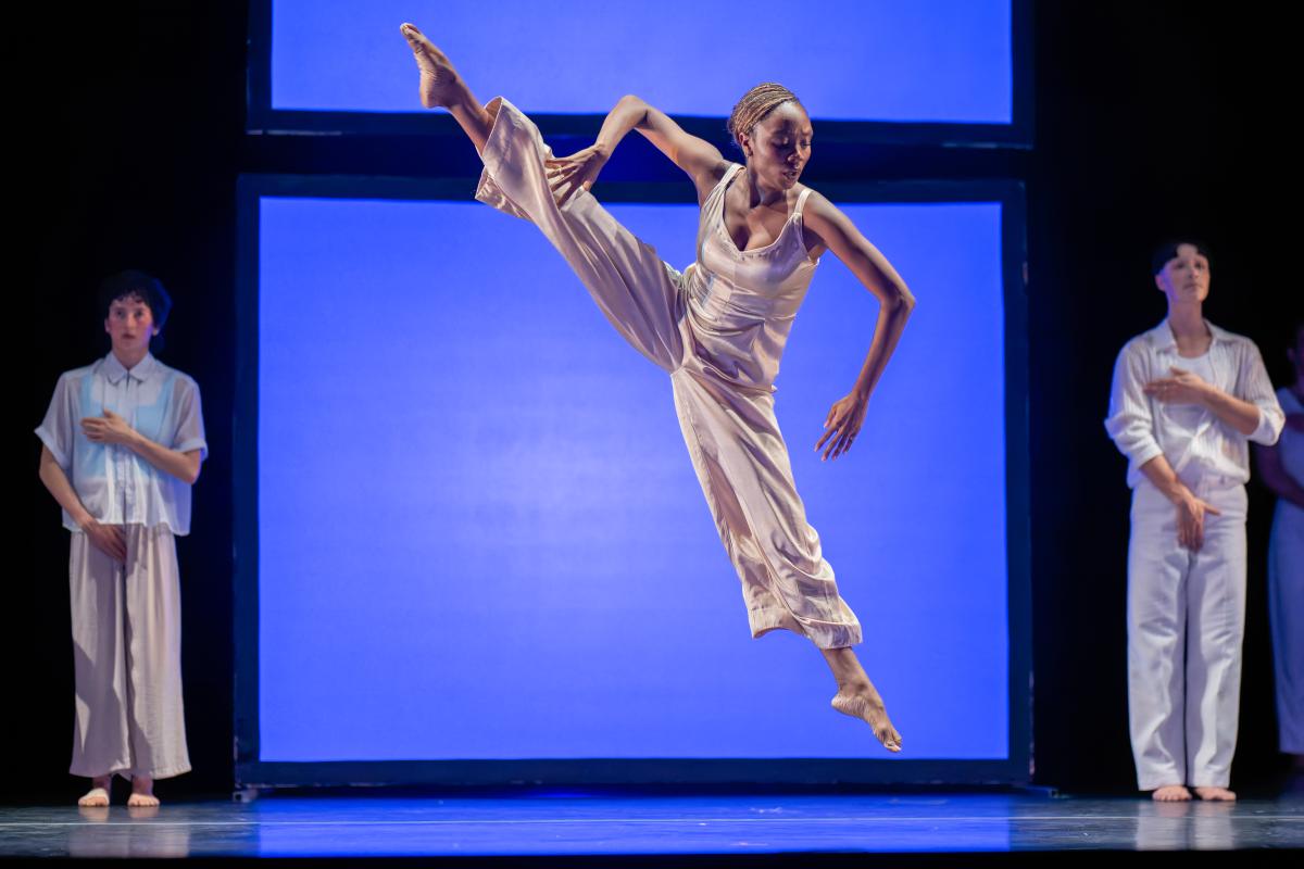 dancers in front of blue background