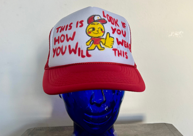 Mannequin head wearing a sample trucker hat