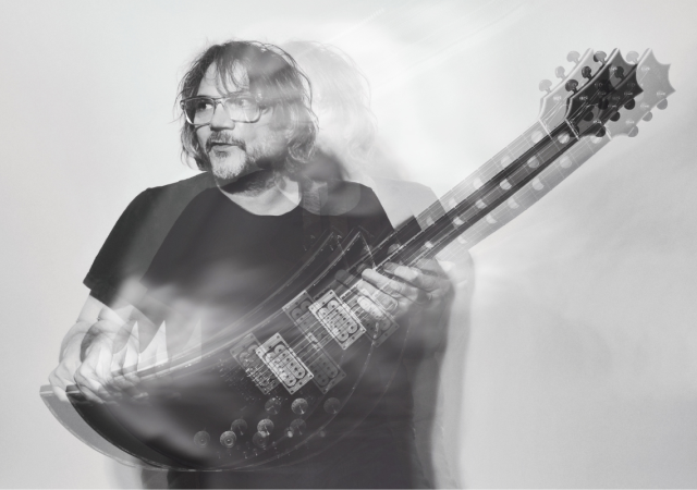 Black and white photo of Jeff Tweedy