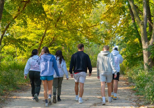 Individuals on a hike at Picnic Point