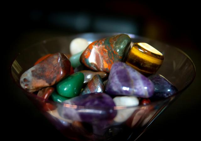 Bowl of assorted polished stones of various shapes and sizes