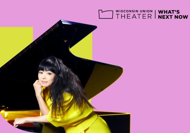 Photo of Hiromi in front of a pink and lime background