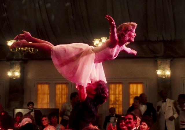 two individuals performing a dance lift