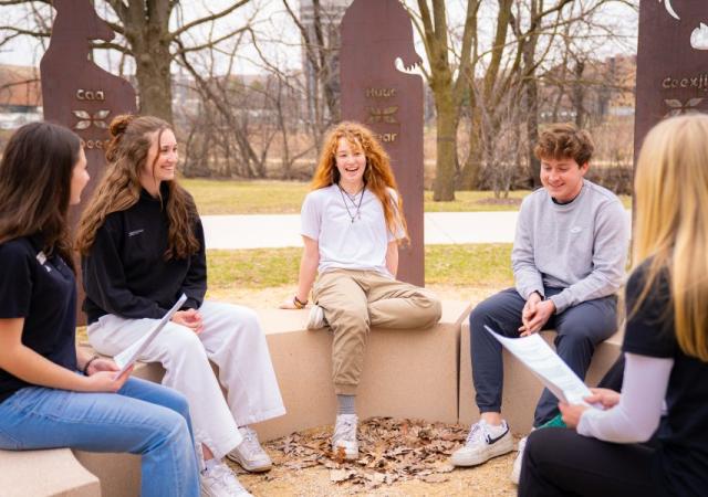 A small group of peers receive wellness coaching.