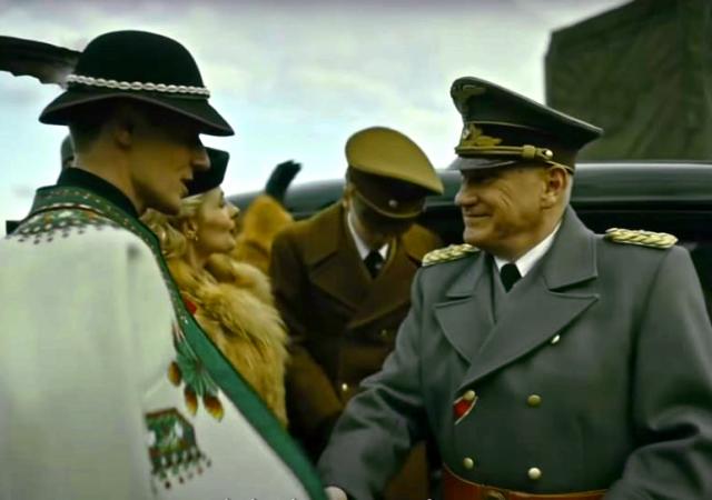Still from film White Courage (2024), two men in military uniforms shake hands.