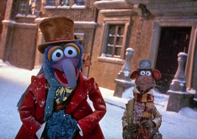Still from Muppets Christmas Carol, Gonzo and Rizzo stand in a snowy street.