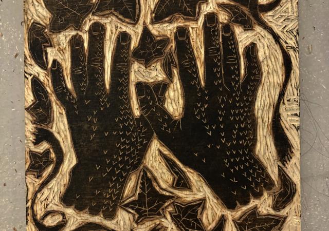 Woodcut featuring two hands.