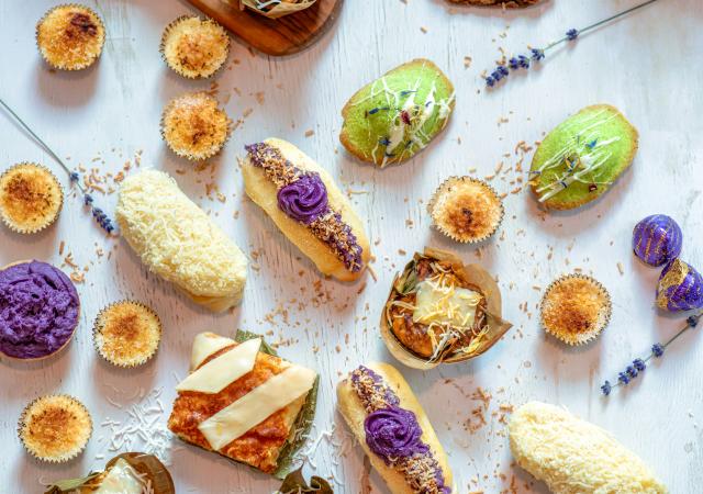 Colorful desserts and snacks on a white tablecloth