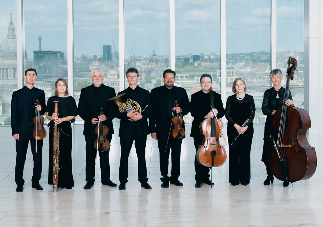 Academy of St Martin in the Fields Octet standing in front of a skyline.