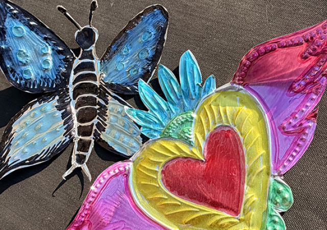 Photo of creafted coloful brilliant tin folk art.