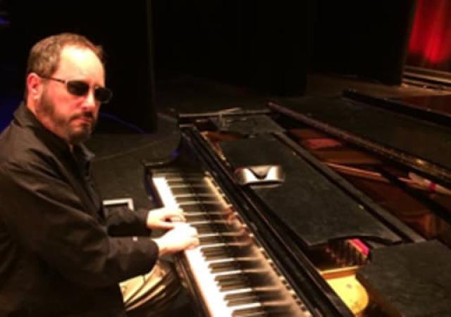 Dave Stoler playing the keyboard.