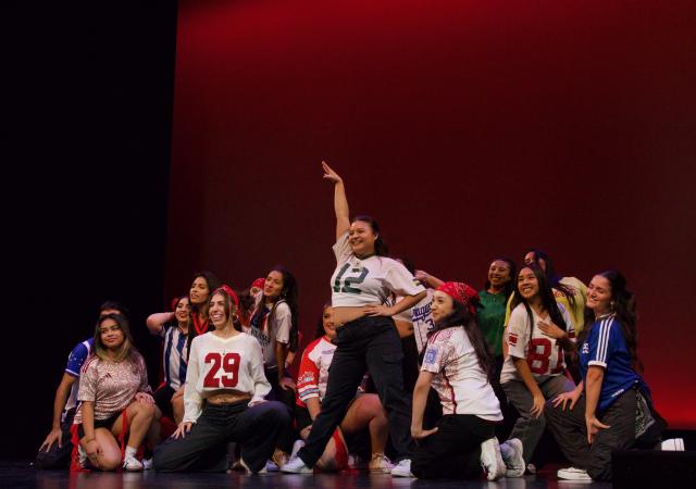 Fuego Crew posing on stage