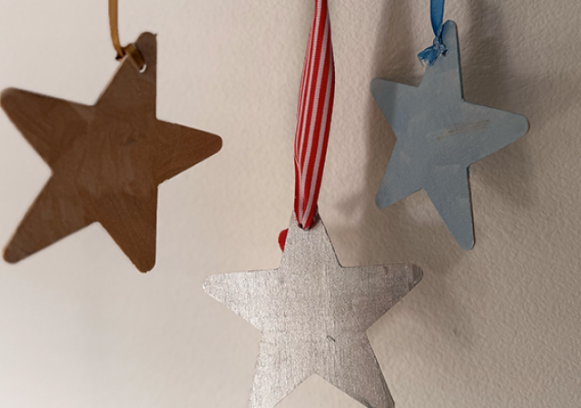 Photo of a reflective mobiles that has stars.