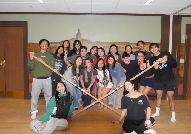 FASO Tinikling group posing with bamboo sticks