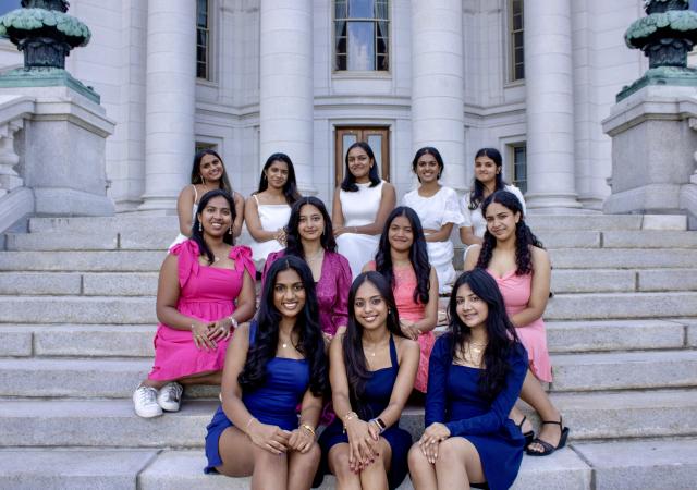 Wisconsin Vira group sitting on stairs and posing for camera