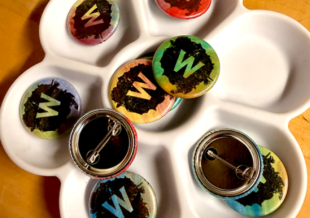Photo of a collection of buttons with the letter "W".