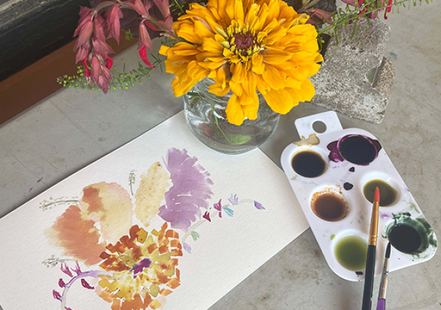 Photo of a watercolor painting based off flowers.