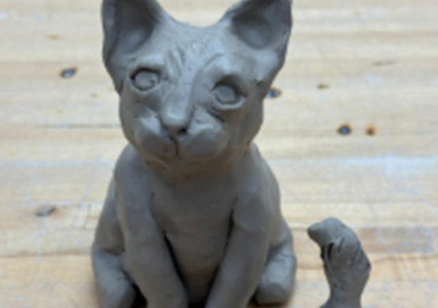 Photo of a cat made from hand building clay.