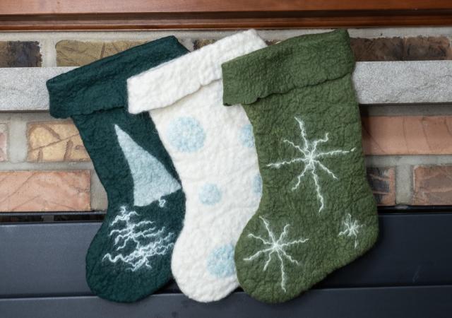 Photo of three felted stockings.