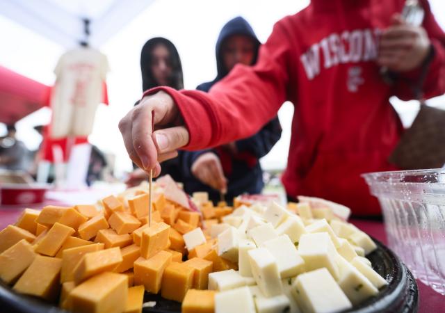 A Badger samples Babcock Dairy cheese